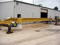 Typical used/refurbished; top-riding, single girder crane with identical 5 ton hoists.