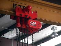Typical surplus, low headroom, 15 ton capacity, monorail hoist on used/refurbished crane bridge.